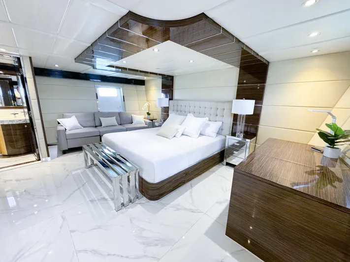  Yacht Photos Pics Luxurious bedroom on a 2010 Custom WHS Marine yacht with modern decor and marble flooring.
