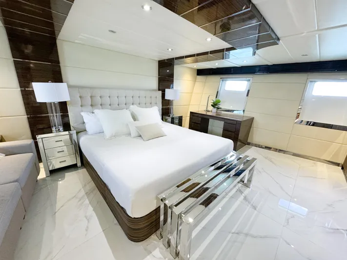  Yacht Photos Pics Luxurious bedroom in a 2010 Custom WHS Marine yacht with modern decor and elegant furnishings.
