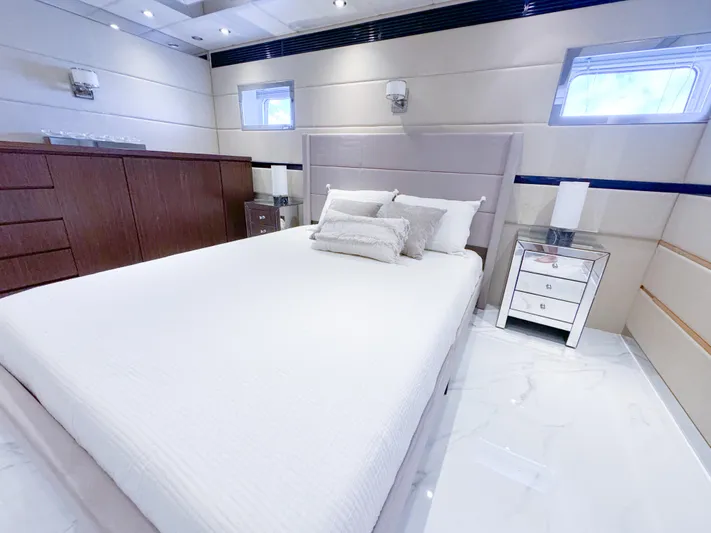  Yacht Photos Pics Luxurious bedroom on a 2010 Custom WHS Marine yacht with modern decor.
