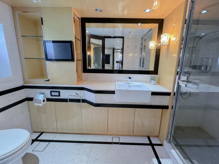  Yacht Photos Pics Modern bathroom in a 2010 Custom WHS Marine yacht with sleek fixtures and large mirror.