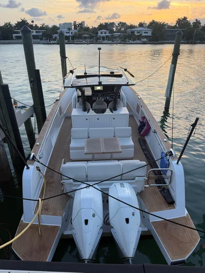  Yacht Photos Pics 2022 Pardo Yachts 38 docked at sunset, featuring twin engines and spacious deck.