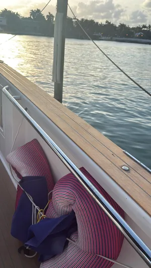  Yacht Photos Pics 2022 Pardo Yachts 38 deck with cushions, overlooking serene water at sunset.