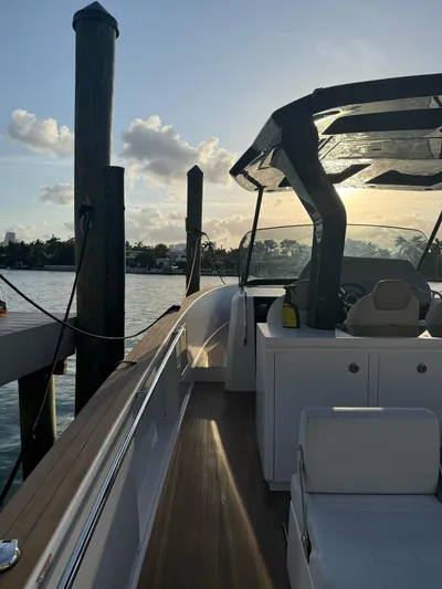  Yacht Photos Pics 2022 Pardo Yachts 38 docked at sunset, showcasing sleek design and luxury features.