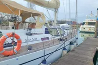 Sailing yacht Comar Comet 51 Dh, 2002, docked with lifebuoy and canopy.