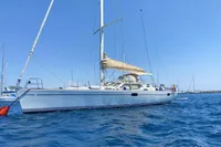 Sailing yacht Comar Comet 51 Dh 2002 on blue ocean under clear sky.