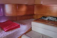 Cozy cabin interior of 2002 Comar Comet 51 Dh sailboat with wooden finish.