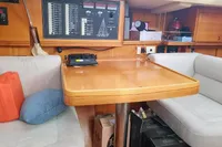 Interior of 2002 Comar Comet 51 Dh yacht with seating and control panel.