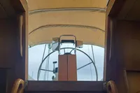Cockpit view of 2002 Comar Comet 51 Dh sailboat with covered helm.
