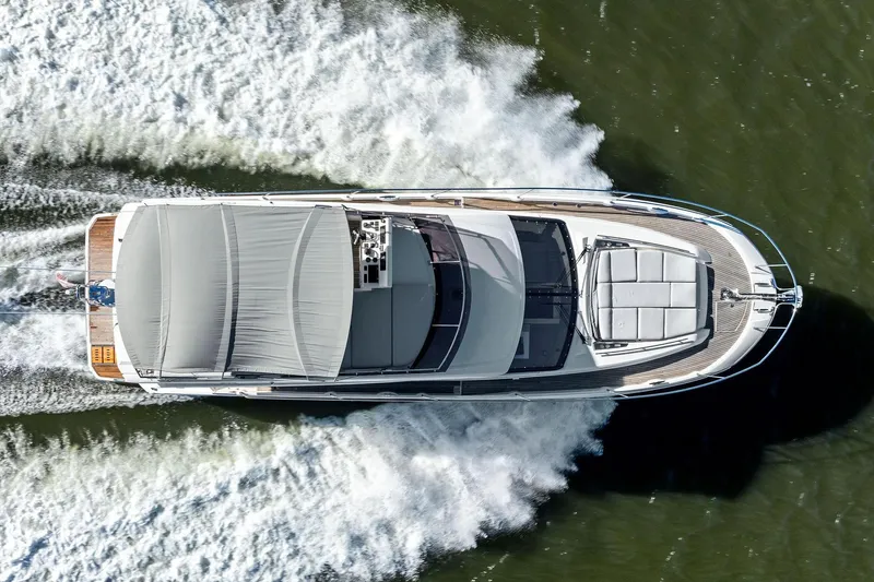 Yacht Photos Pics Top view of a 2019 Prestige 520 yacht cruising on water.