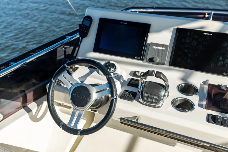  Yacht Photos Pics Helm of 2019 Prestige 520 yacht with modern navigation equipment.