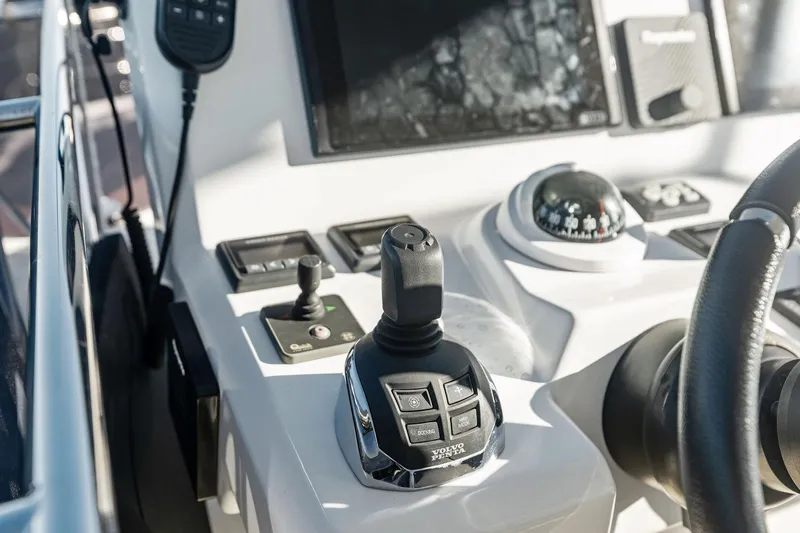  Yacht Photos Pics Control panel of a 2019 Prestige 520 yacht with joystick and compass.