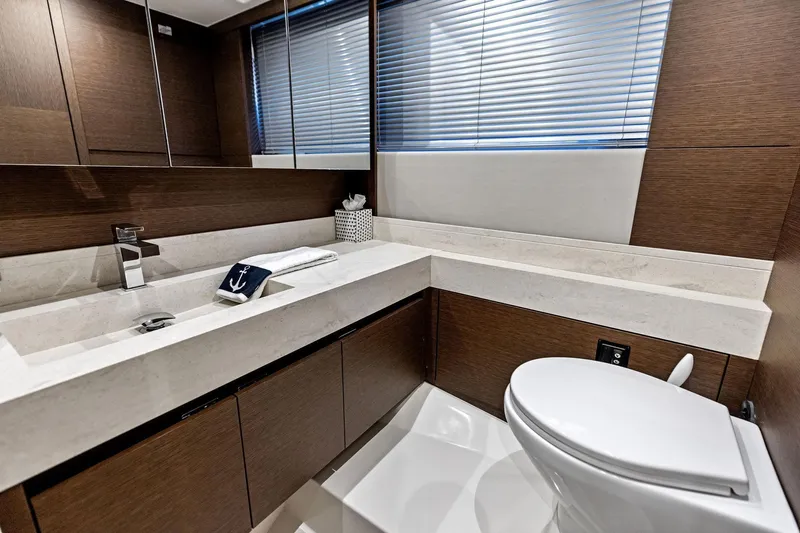  Yacht Photos Pics Luxurious bathroom in 2019 Prestige 520 yacht with modern fixtures and elegant design.