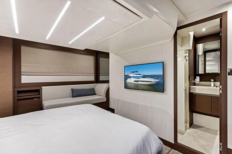  Yacht Photos Pics Luxurious interior of 2019 Prestige 520 yacht with modern bedroom and ensuite bathroom.