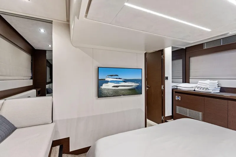 Yacht Photos Pics Luxurious interior of 2019 Prestige 520 yacht with modern decor and wall-mounted TV.