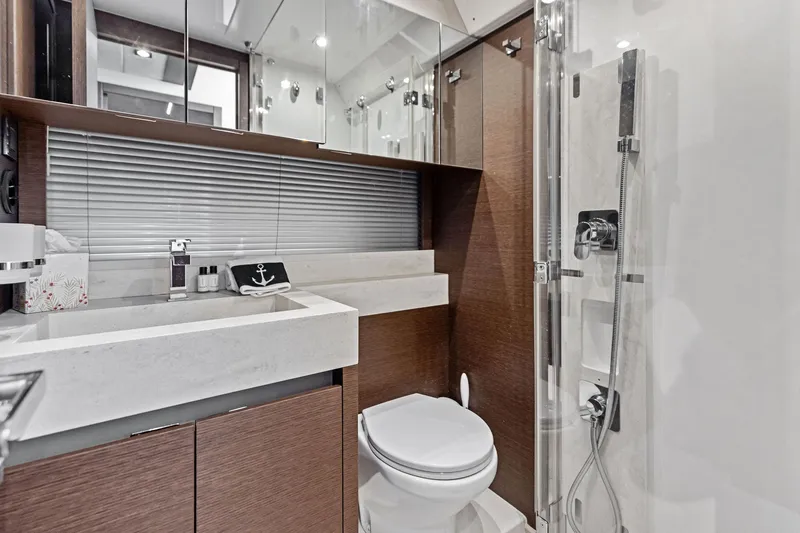  Yacht Photos Pics Luxurious bathroom in 2019 Prestige 520 yacht with modern fixtures and elegant design.