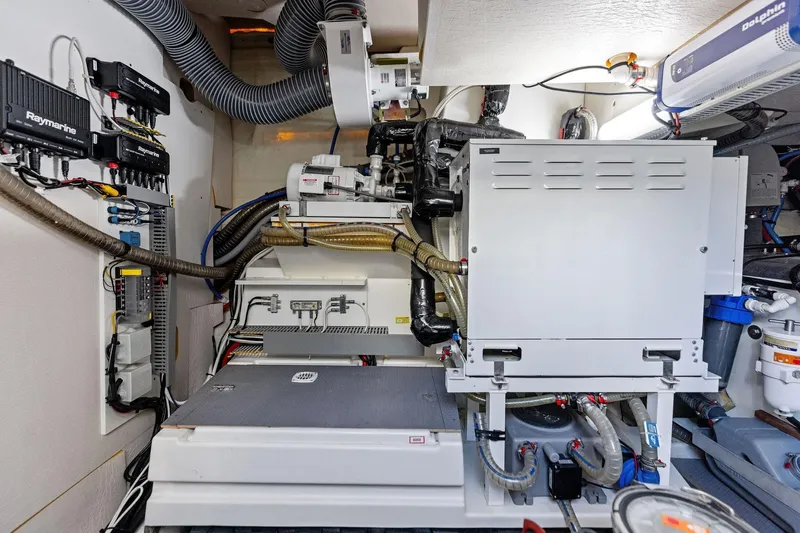  Yacht Photos Pics Engine room of a 2019 Prestige 520 yacht with advanced equipment and wiring.