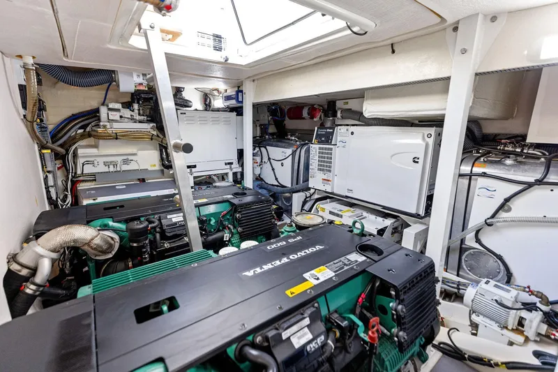  Yacht Photos Pics Engine room of a 2019 Prestige 520 yacht, featuring Volvo Penta engines and advanced equipment.