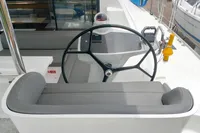 2023 Seawind 1600 Passagemaker helm with steering wheel and navigation controls.