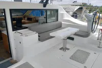 2023 Seawind 1600 Passagemaker cockpit with seating, table, and helm station.