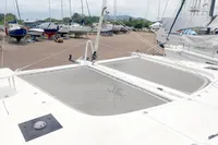 2023 Seawind 1600 Passagemaker catamaran on land, showcasing deck and netting.