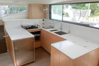 Modern kitchen interior of 2023 Seawind 1600 Passagemaker yacht with sleek design and appliances.