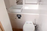2023 Seawind 1600 Passagemaker bathroom with modern sink and toilet.