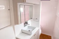 Modern bathroom interior of 2023 Seawind 1600 Passagemaker yacht, featuring sleek design and fixtures.
