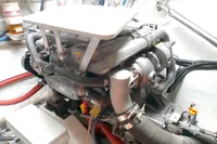 Engine room of 2023 Seawind 1600 Passagemaker, featuring Yanmar marine engine components.