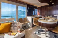 Luxurious interior of 2012 Bering 60 yacht with elegant seating and scenic ocean view.