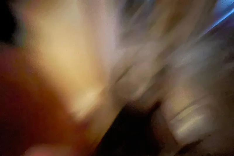  Yacht Photos Pics Blurry abstract image with warm tones, possibly depicting motion or light effects.