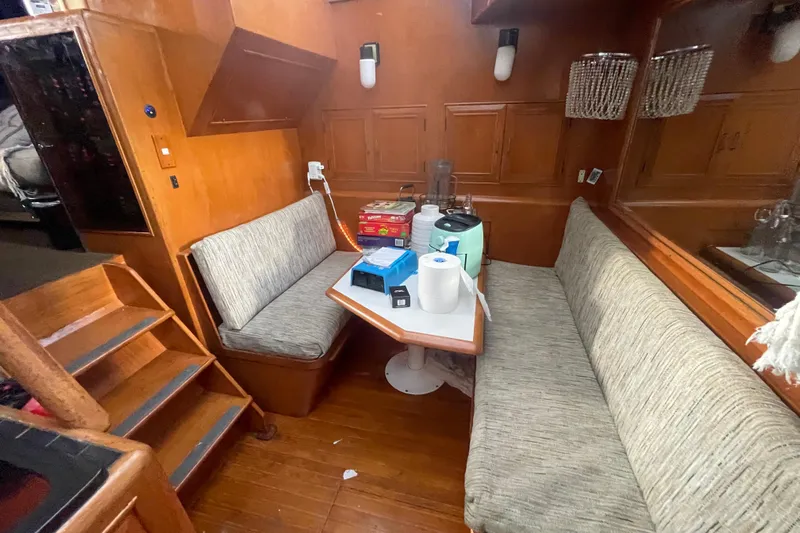  Yacht Photos Pics 1988 Marine Trader Aft Cabin interior with seating area and wooden finishes.