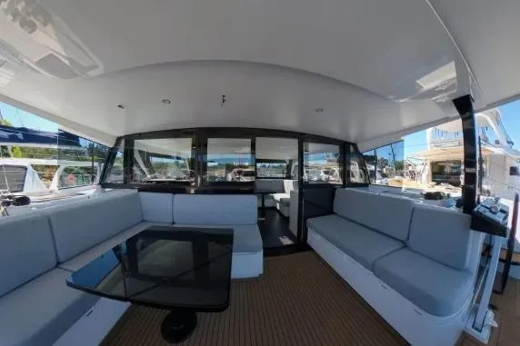 Curiosity Yacht Photos Pics Luxurious interior of 2024 HH Catamarans OC 44 with spacious seating and modern design.