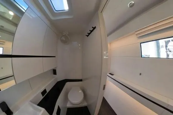 Curiosity Yacht Photos Pics 2024 HH Catamarans OC 44 bathroom interior with modern design and skylight.