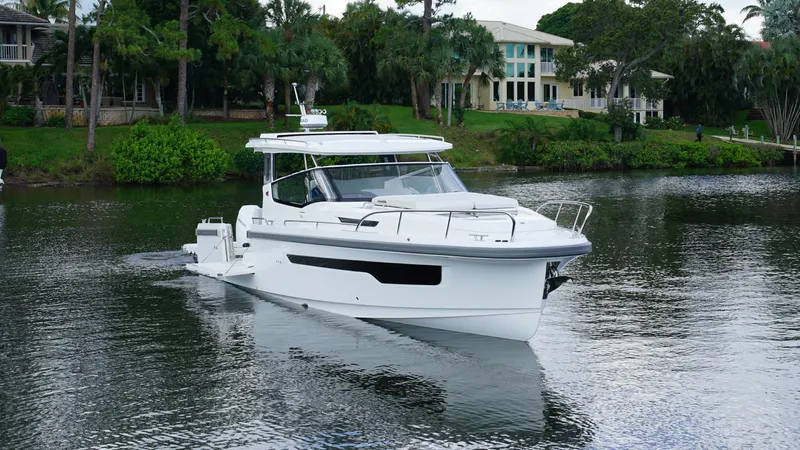 In-stock 2025 Nimbus W11 #60 Yacht Photos Pics 2025 Nimbus Weekender 11 #60 boat cruising on a serene lake.