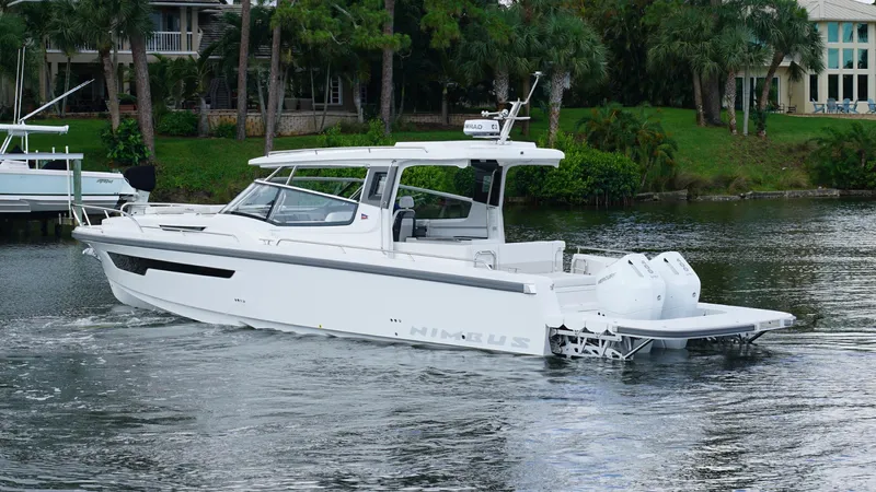 In-stock 2025 Nimbus W11 #60 Yacht Photos Pics 2025 Nimbus Weekender 11 #60 boat cruising on a calm river.