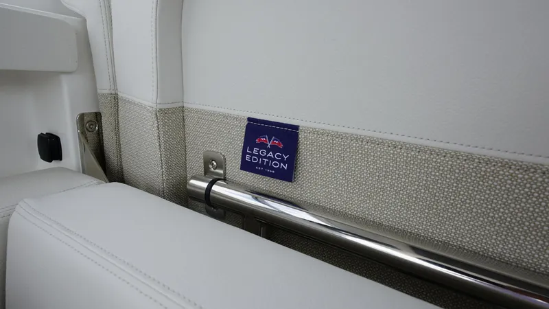 In-stock 2025 Nimbus W11 #60 Yacht Photos Pics Nimbus Weekender 11 Legacy Edition interior detail, featuring sleek white upholstery and metal accents.