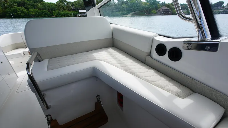 In-stock 2025 Nimbus W11 #60 Yacht Photos Pics Luxurious seating on 2025 Nimbus Weekender 11 #60 boat, with scenic water view.
