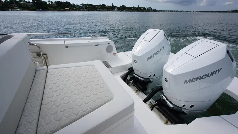 In-stock 2025 Nimbus W11 #60 Yacht Photos Pics Luxury Nimbus Weekender 11 boat with dual Mercury engines on a serene lake, 2025 model.