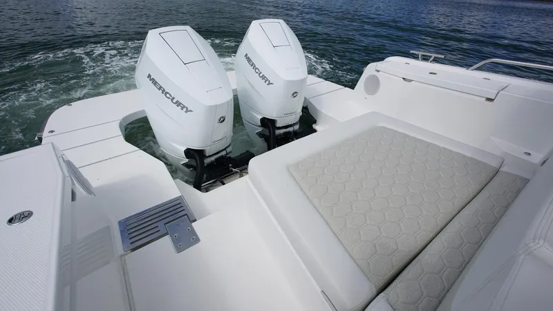 In-stock 2025 Nimbus W11 #60 Yacht Photos Pics 2025 Nimbus Weekender 11 #60 boat with twin Mercury engines and cushioned seating.