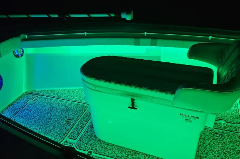  Yacht Photos Pics 2002 Yellowfin 31 Center Console boat interior with vibrant green LED lighting.