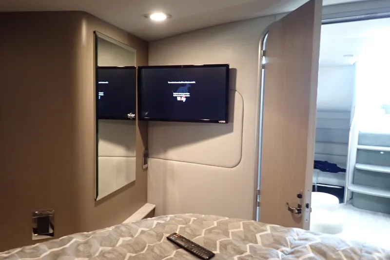  Yacht Photos Pics Interior of 2020 Formula 40 Performance Cruiser with TV, mirror, and open door.