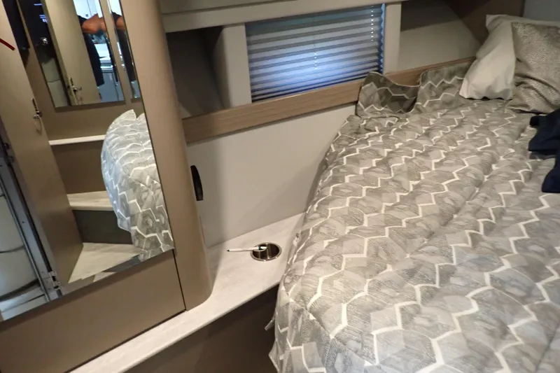  Yacht Photos Pics 2020 Formula 40 Performance Cruiser interior with bed, mirror, and modern decor.