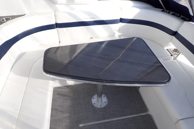  Yacht Photos Pics 2020 Formula 40 Performance Cruiser interior with sleek table and cushioned seating.