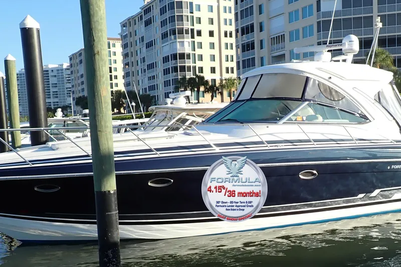  Yacht Photos Pics 2020 Formula 40 Performance Cruiser docked near waterfront buildings.