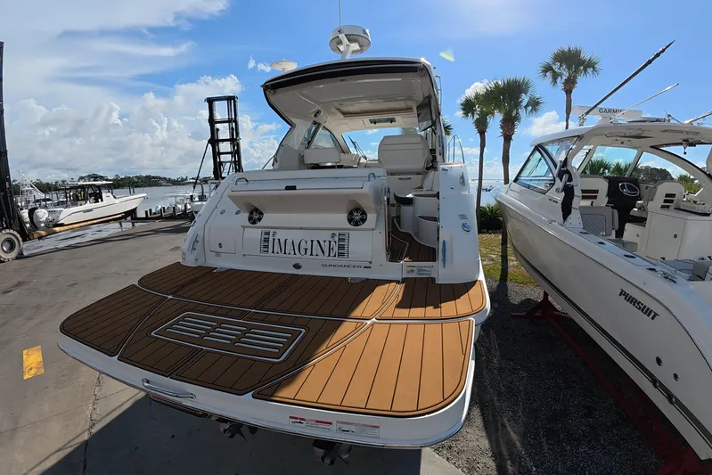  Yacht Photos Pics 2021 Sea Ray Sundancer 350 Coupe docked, showcasing elegant design and spacious deck.