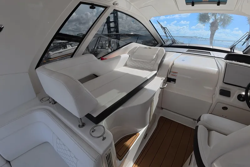 Yacht Photos Pics Interior of 2021 Sea Ray Sundancer 350 Coupe with luxurious seating and panoramic windows.