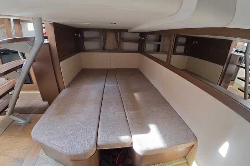  Yacht Photos Pics Interior cabin of 2021 Sea Ray Sundancer 350 Coupe with cozy seating and wooden accents.