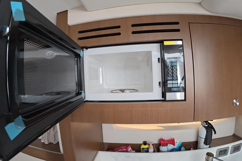  Yacht Photos Pics Microwave in 2021 Sea Ray Sundancer 350 Coupe yacht kitchen interior.