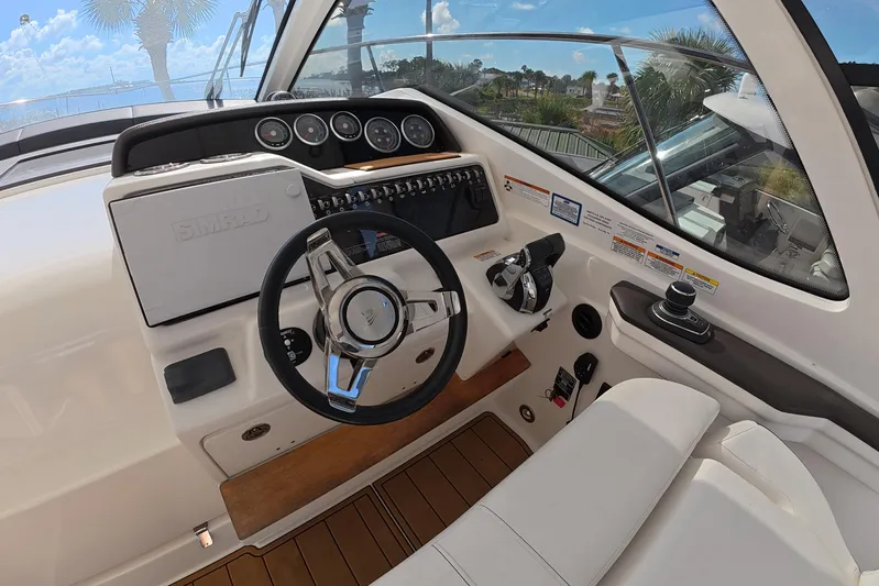  Yacht Photos Pics Helm of 2021 Sea Ray Sundancer 350 Coupe with modern controls and steering wheel.