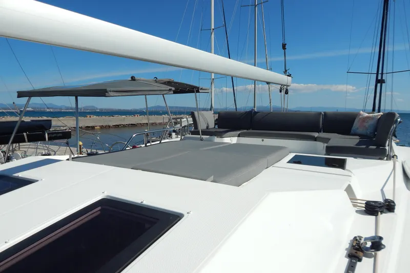  Yacht Photos Pics 2023 Fountaine Pajot Catamaran Elba 45 with spacious deck and seating area.